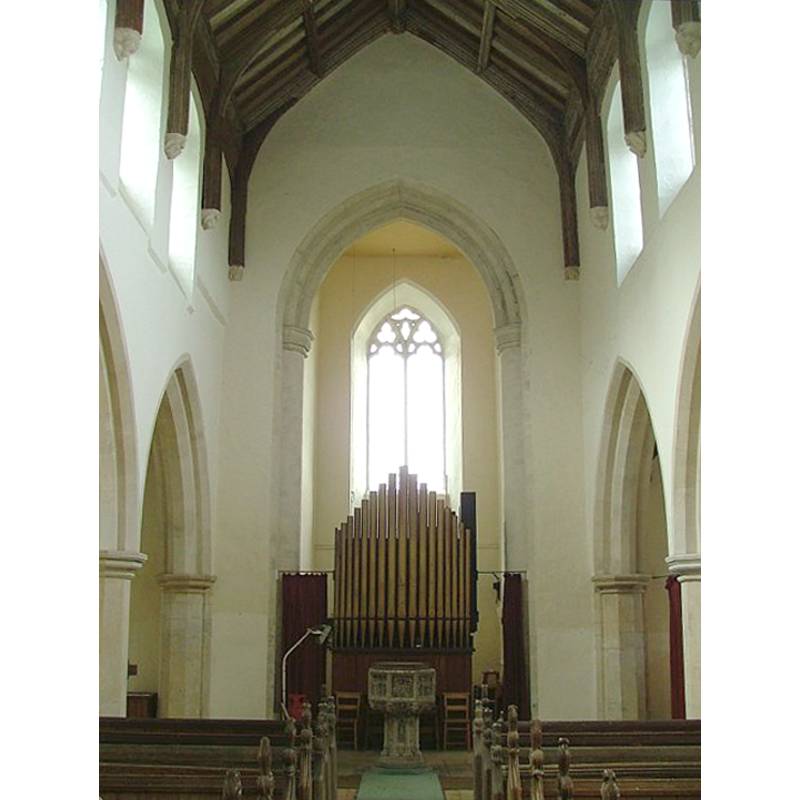 the font and cover are visible in front of the organ, at the west end