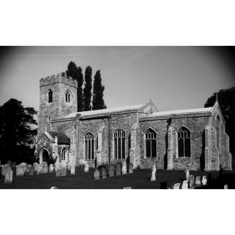 Photo caption: "The west tower is 14c, the nave and south porch Perpendicular"
