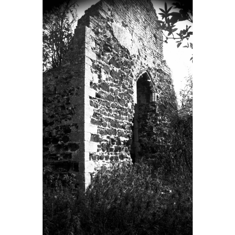 Photo caption: "Fragmentary ruins. The Norman doorway mentioned by Claude Messent being here in 1931 has disappeared"