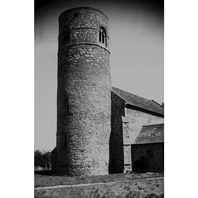 Photo caption: "Pre-conquest round tower. 12c top with double-light window"