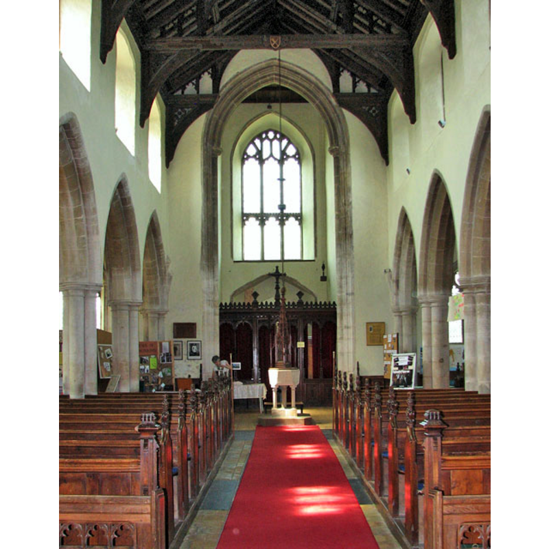 the font and cover are visible here at the west end of the nave