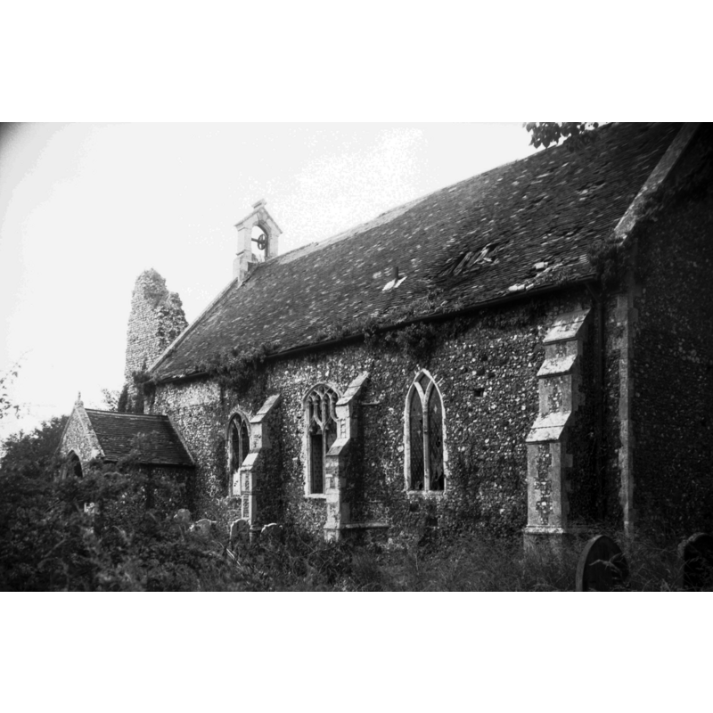 Photo caption: "The church is mainly Decorated with some Perpendicular insertions. It consists of nave and chancel only, the roof being continuous as there is no chancel arch. Some ruins of the old tower remain at the west end"