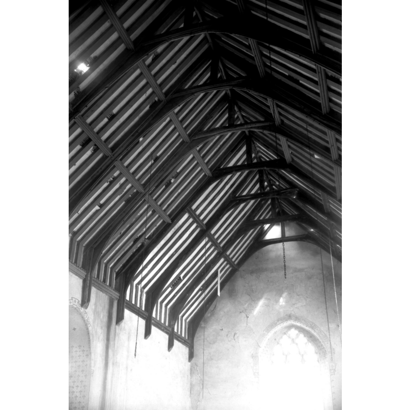 Photo caption: "Early 16c arch-braced roof"