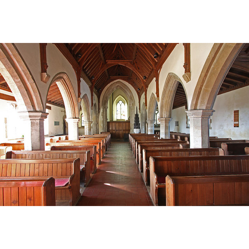 the font and cover are partially visible towards the west end of the nave, by the last arch of the north arcade