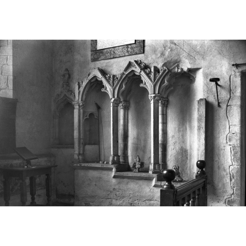 Photo caption: "14c piscina and sedilia south side of chancel, showing remains of canopy and groining"