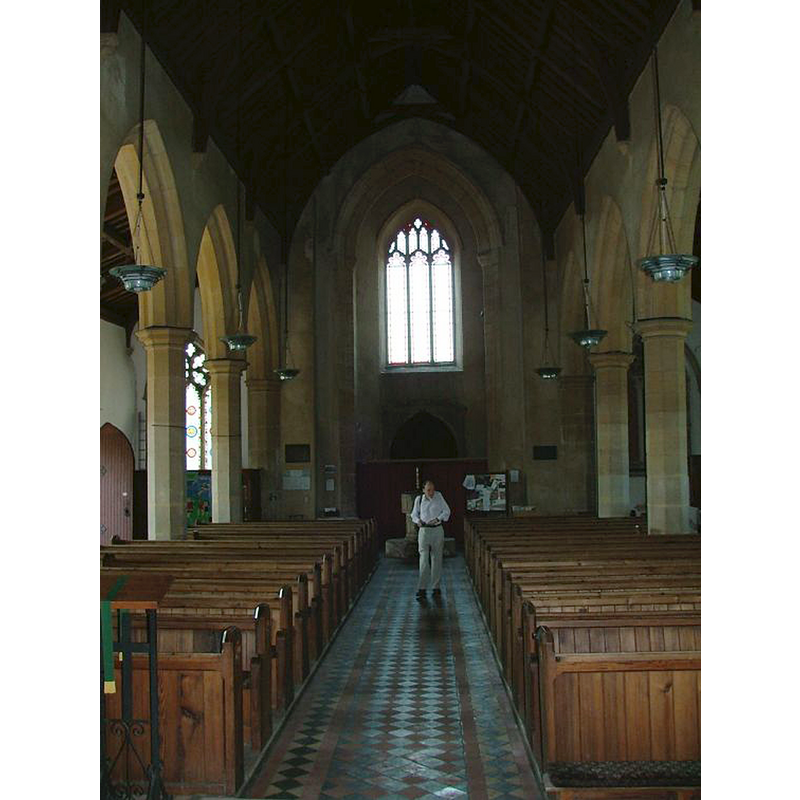 the font is partially visible at the west end of the nave