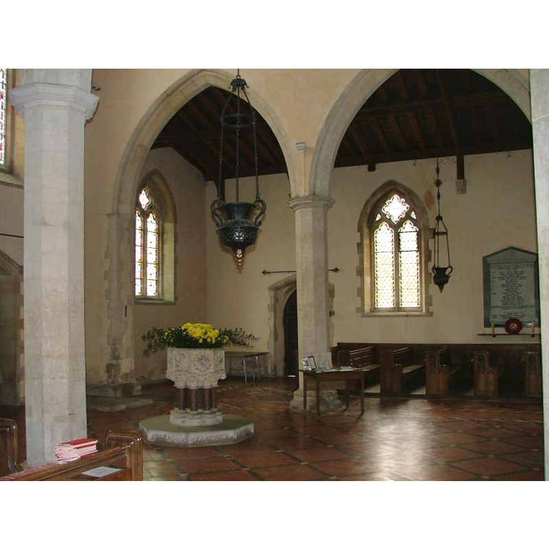 the modern font [cf. FontNotes] at the west end of the nave; behind are the north aisle and the north doorway