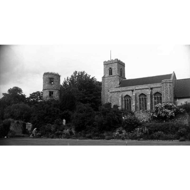 the old round tower is part of the Old Hall, not of the church