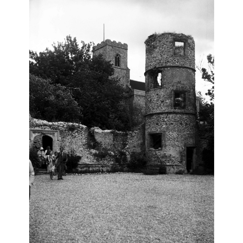 Photo caption: "NE inner tower, and church of St John Baptist behind"