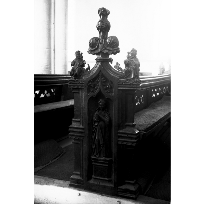 Photo caption: "15c bench end, north side of nave"