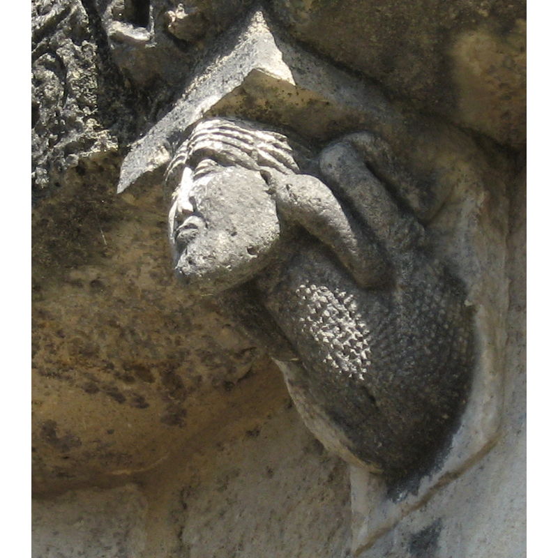 one of the three in the previous photograph: a reptilian with a human head?