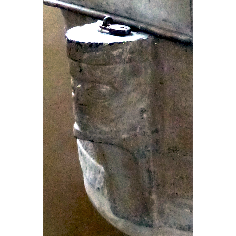 notice the metal anchor ring atop the head on the left; it must have been used as anchoring also for an earlier, and perhaps more suitable, font cover