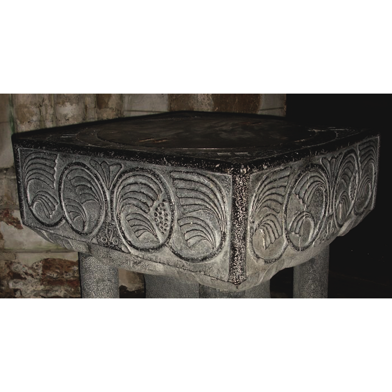 all four upside down, in the lower spandrel of the vine