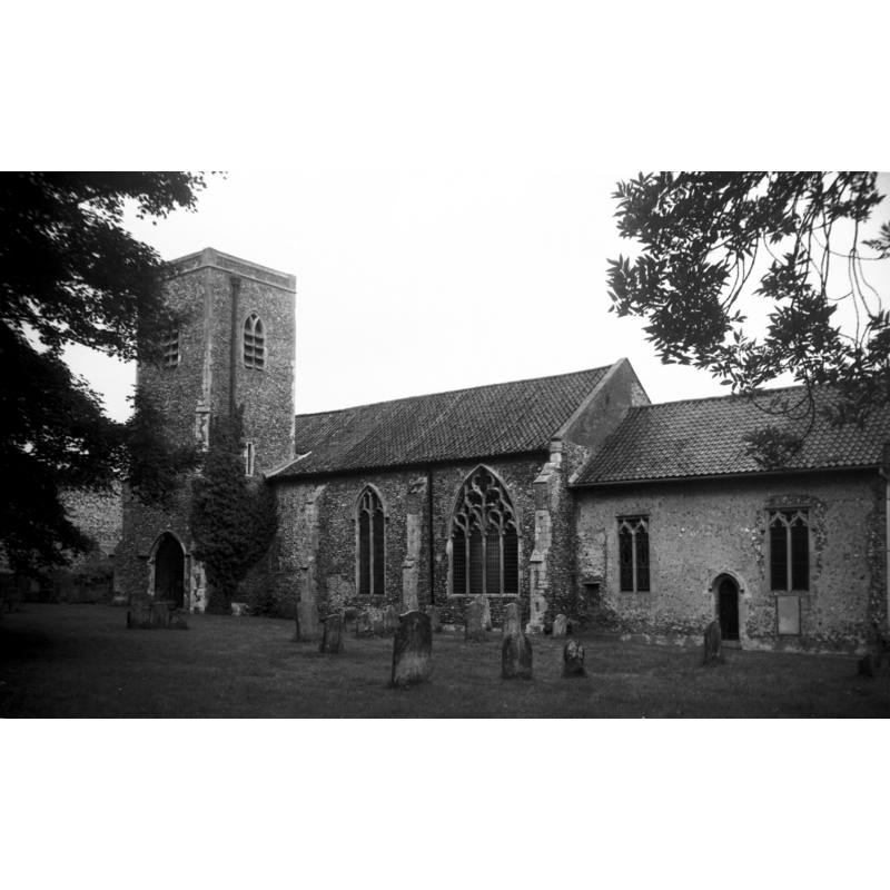 Photo caption: "14c tower attached to the SW corner of the nave. Fine Decorated tracery in the SE window of the nave"
