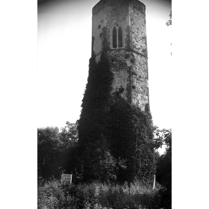 Photo caption: "Except for the octagonal tower and south porch, the church was pulled down in 1883 and a new church erected in a more central part of the parish"