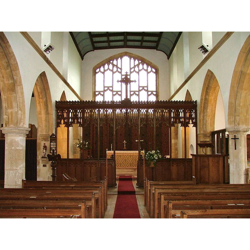 the new church showing the 16th-century chancel screen from the old church, re-cycled here