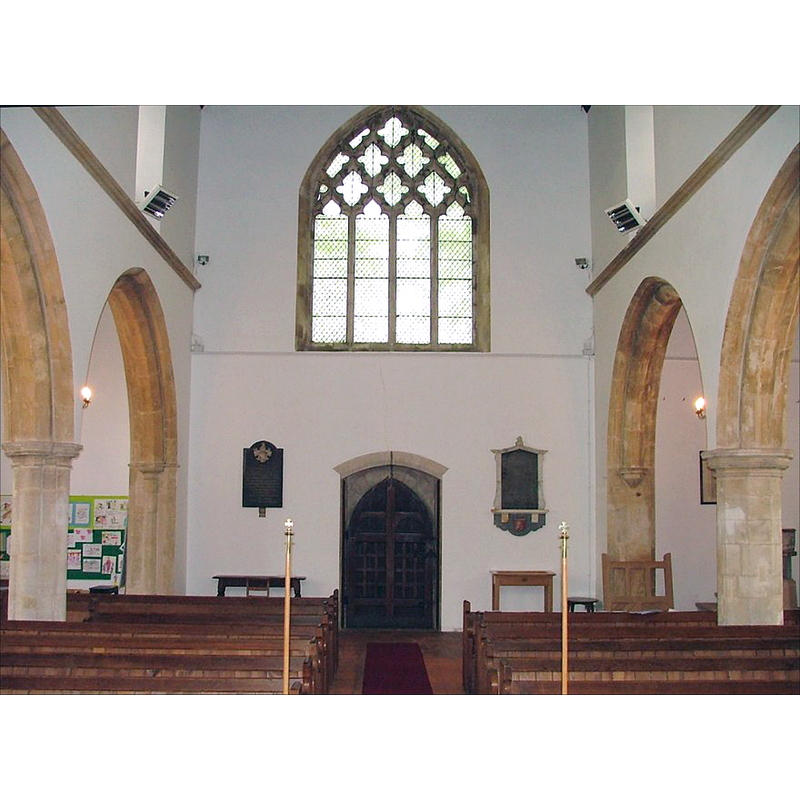 the new church -- the old restored font is located in the north aisle, to the right, and is partially visible behind the pillar of the north arcade