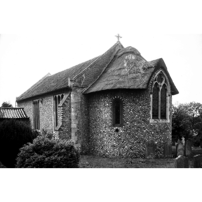 Photo caption: "Largely rebuilt in brick 1744. The apse is 1925"