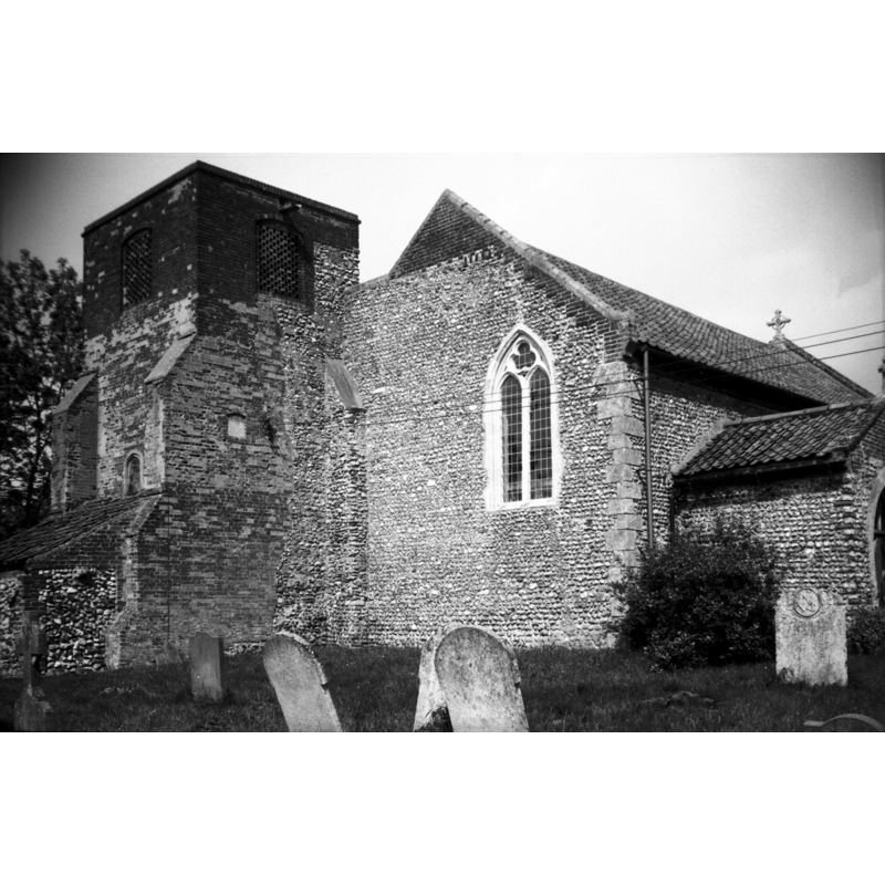Photo caption: "The two-light window in the west wall must have belonged to an Early English aisle later removed"