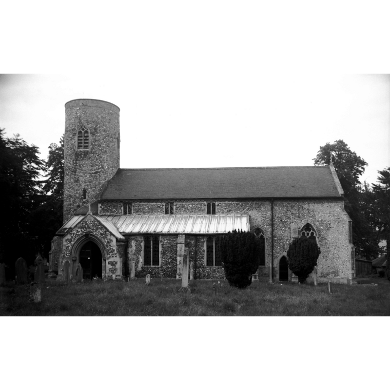 Photo caption: "Norman round tower, the remainder is mainly Decorated"