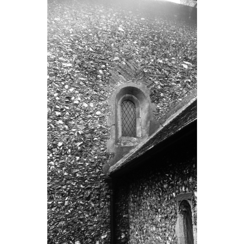 Photo capton: "On the north side of nave. Unusual brickwork above arch"