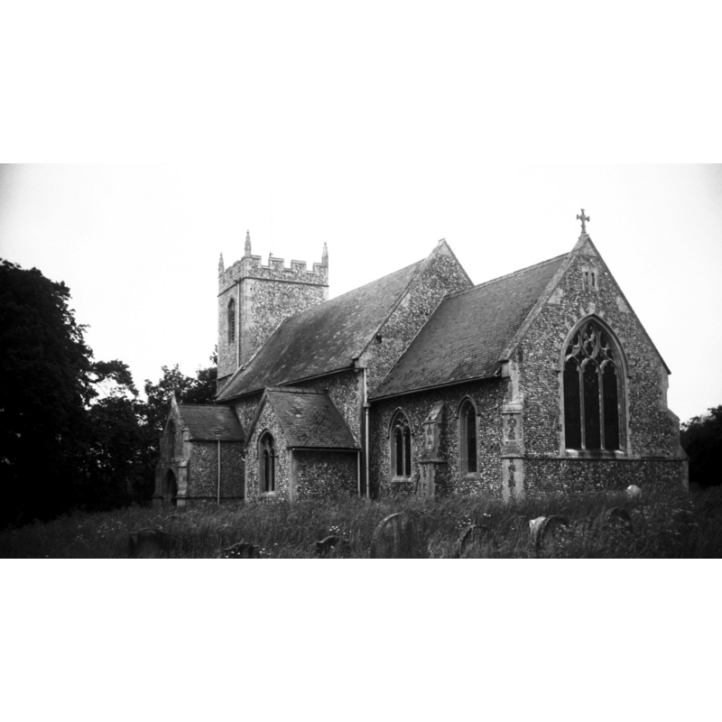 Photo caption: "The chancel dates from 1883. The Perpendicular tower is unbuttressed"