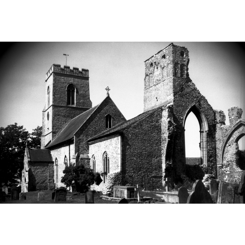 the parish church -- Photo caption: "With ruined priory tower. North of the chancel are the ruins of the Augustinian Priory founded in the reign of King John. It incorporated in its buildings the remains of an earlier Saxon parish church of which the south wall of the tower still stands. The priory was dedicated to the Blessed Virgin Mary and All Saints, and was a cell to that at West Acre"