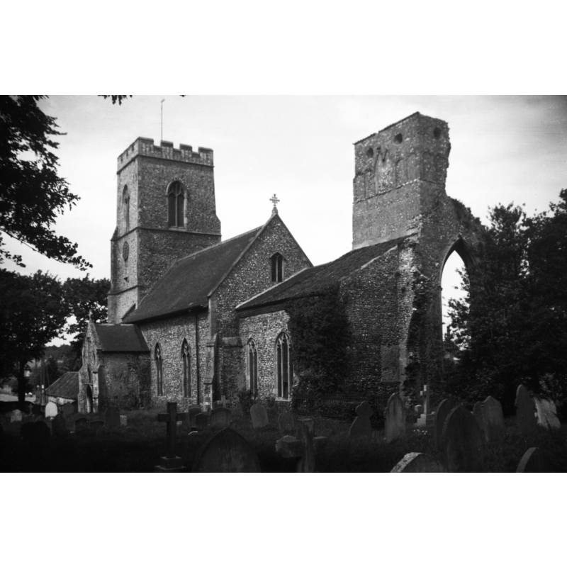 Photo caption: "With ruined priory tower" -- the ruins of the old priory tower attached to the north side of the chancel of the parish church