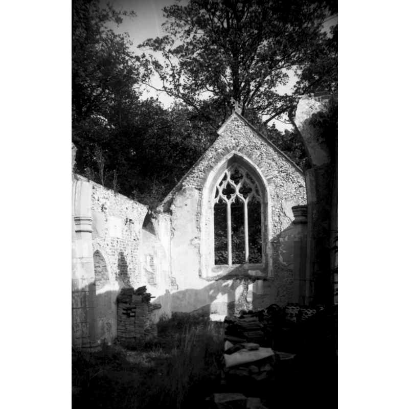 the ruins of St. Paul's -- Photo caption: "Abandoned and partly ruined by the end of the 19c. In 1904 totally restored by the Earl of Leicester. Was then used only as a mortuary chapel. Derelict by the late 1940s. By 1950 the roof had collapsed and the church was in ruins again. The chancel arch and most of the chancel roof collapsed sometime between 1978 and 1983"