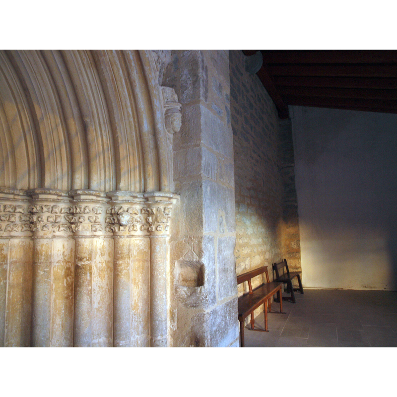 a holy-water stoup carved into the right [east] side