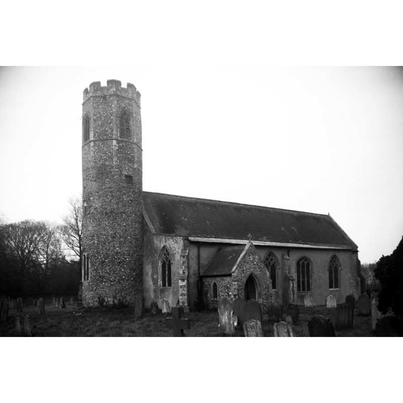 Photo caption: "Norman round tower" [with a later octagonal storey]