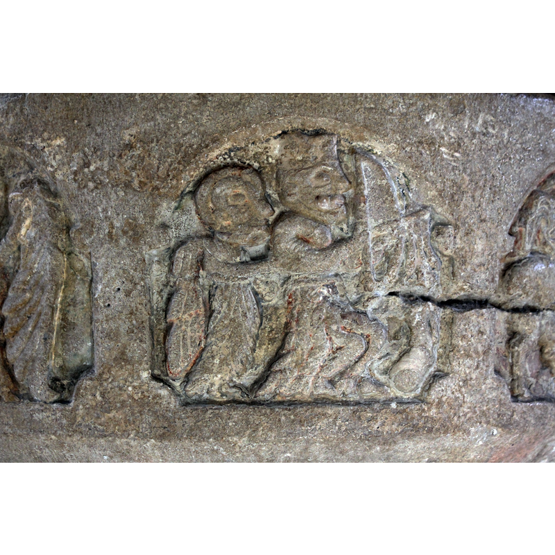 the figure on the left appears to be an angel; the figure on the right is crowned and holds a bow and arrow pointed to the stag in the next arch -- on the southwest side of the basin [NB: orientation is approximate]