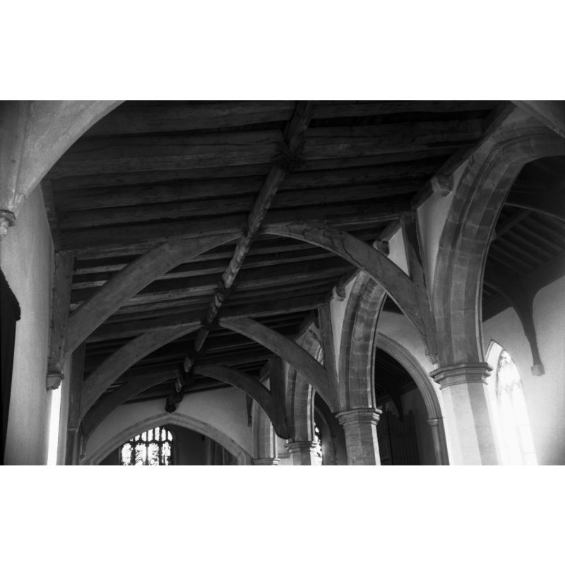 Photo caption: "Plain fully arch-braced roof of north aisle"