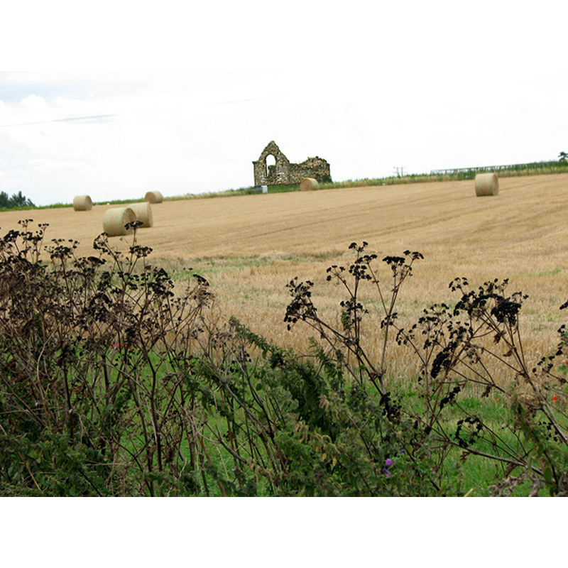 the ruins of the old church in the fields where the hamlet once stood