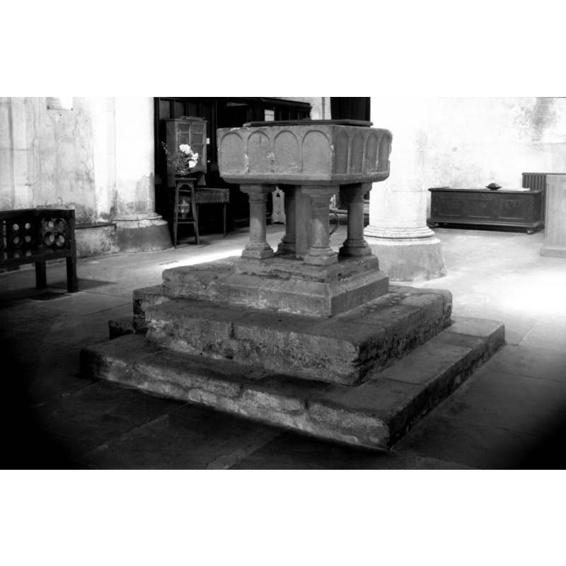Photo caption: "13c square font of Purbeck marble"
