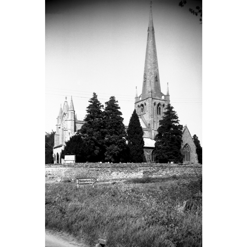Photo caption: "Late 14c tower and spire"
