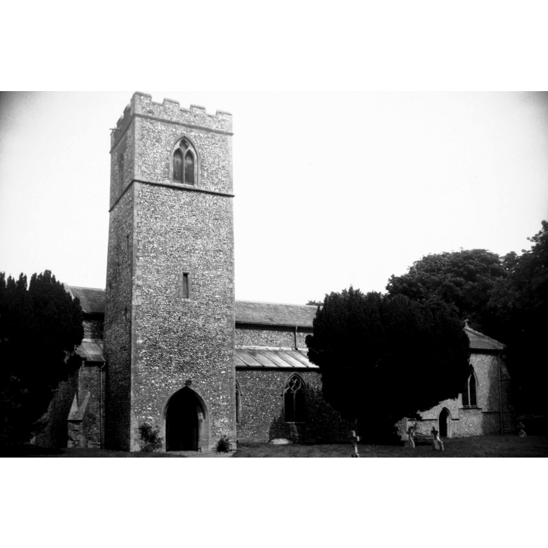 Photo caption: "The base of the 13c tower forms the south porch"