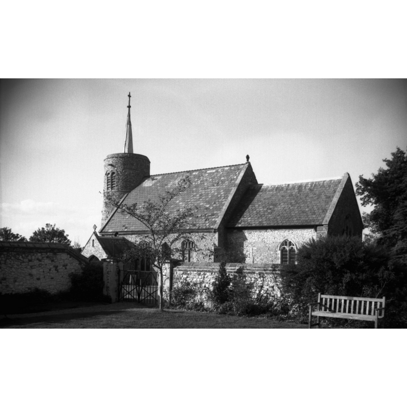 Photo caption: "A blocked south window indicates the chancel is Norman"