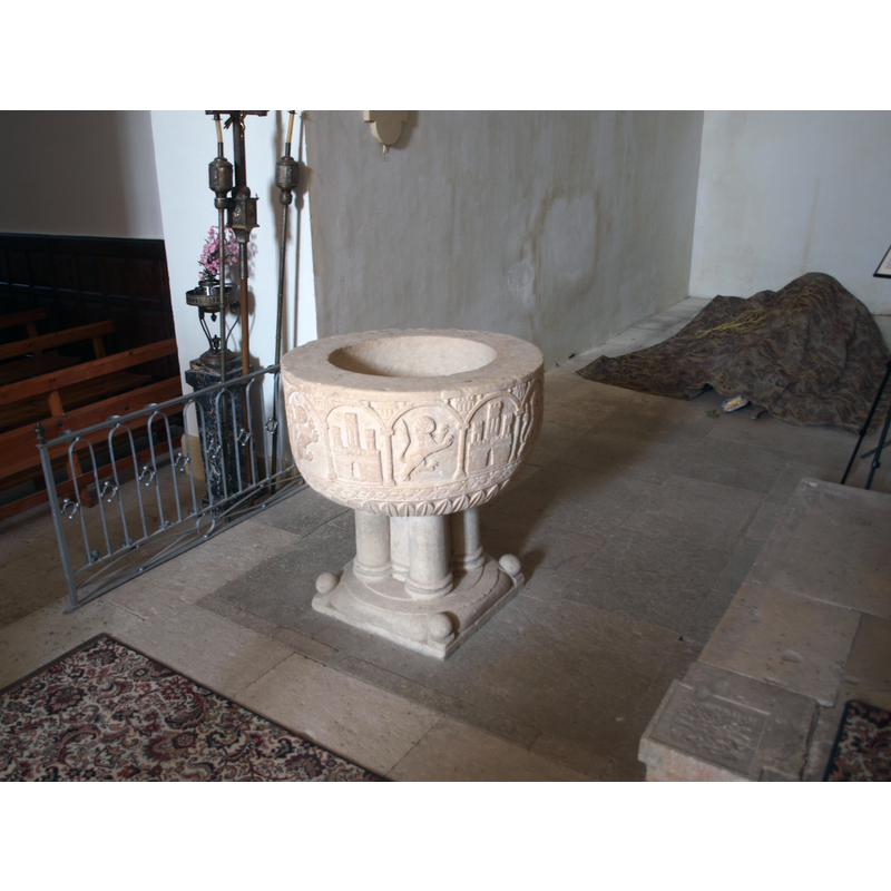 the font is now located in the presbitery of the church