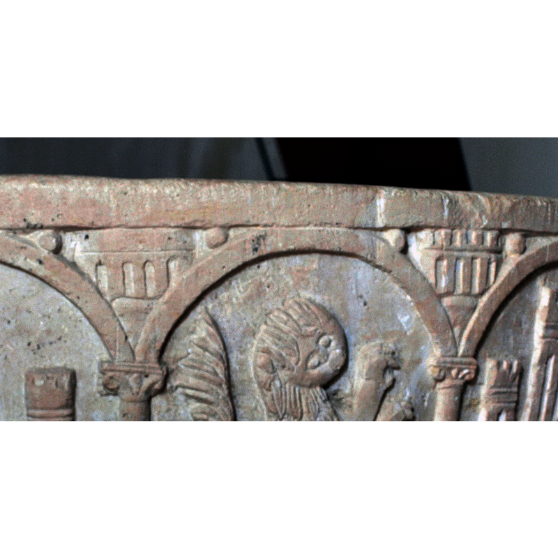 a variety of building motifs in the spandrels of the arcade [cf. FontNotes]