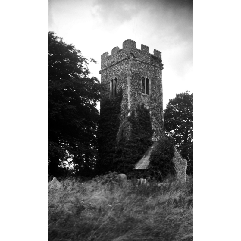 Photo caption: "Serving as a mortuary chapel only, the remainder ruinated when a new church built nearer the village in 1840"