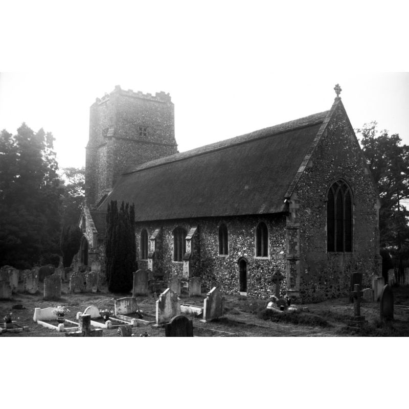 Photo caption: The tower appears never to have been finished as it lacks a top storey. The church is entirely thatched"