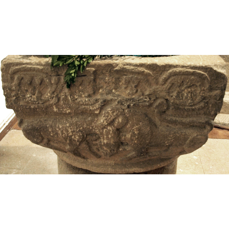 south side of the basin -- the scene is definitely a fight between two animals; the one on the right is a lion, as the tail over the rump attests; the quadruped on the left appears to be a deer or stag, with a very short deer-like tail