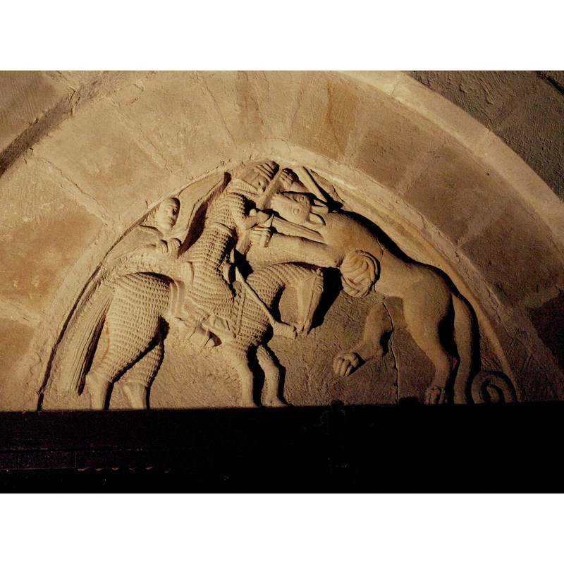 the tympanum of the interior south entrance replicates the theme of the one outside, on the south portal