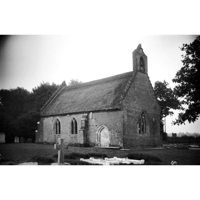 Photo caption: "Entirely thatched, this little church was rebuilt in 1624 and is one of the smallest in the county"