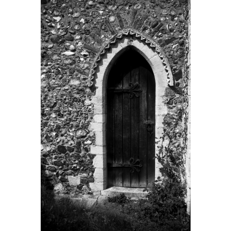 Photo caption: "Priest's door on south side of chancel with 13c dog tooth moulding"