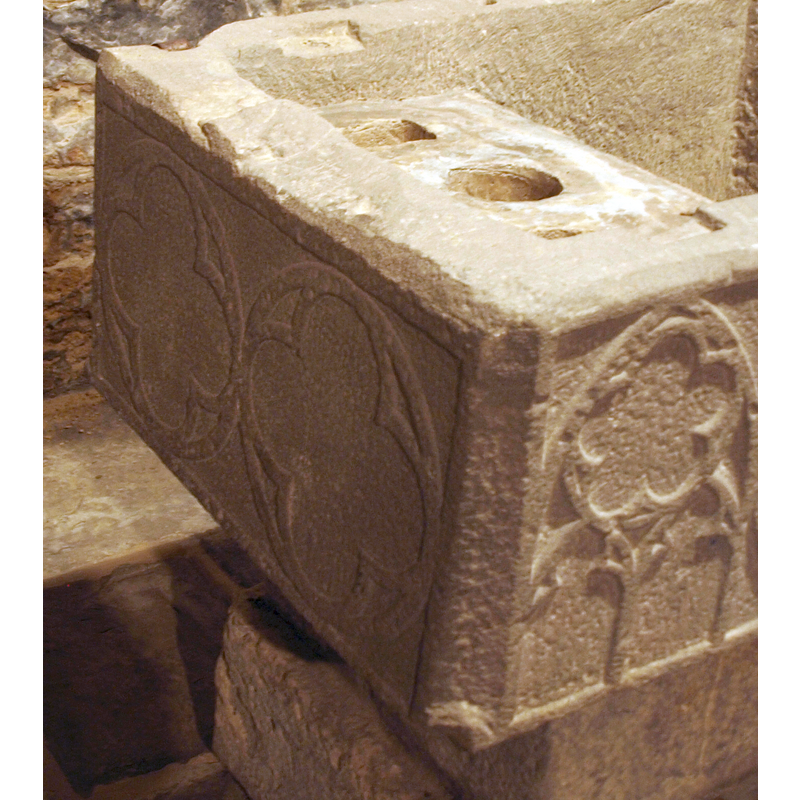 on the side to the left of the Agnus Dei; unlike the ones on the opposite side, these have no floral motifs in them