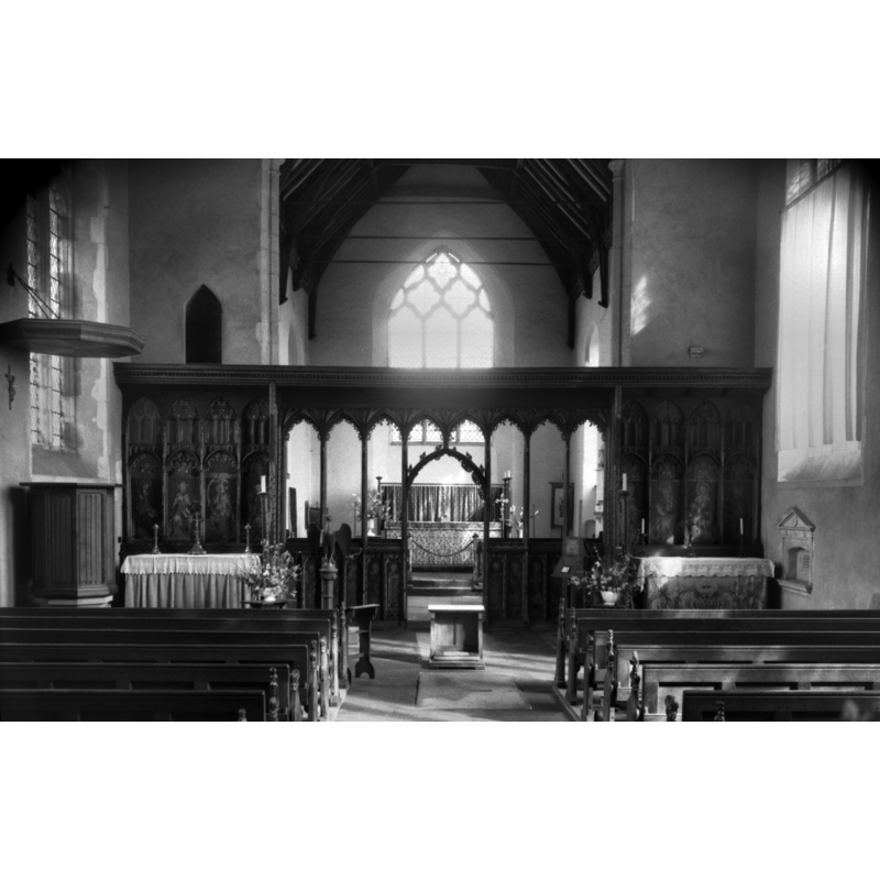 Photo caption: "15c screen. Probably the finest coloured screen in the country, with parcloses and side extensions which form reredoses to side altars"