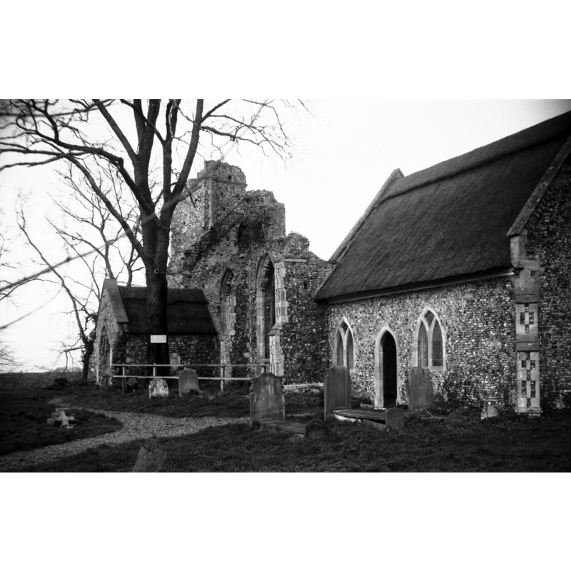 Photo caption: "Struck by lightning in 1762; on[ly] the chancel remains in use"
