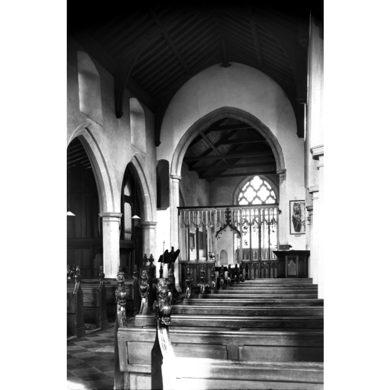 Photo caption: "15c screen and late 15c benches with poppyheads"